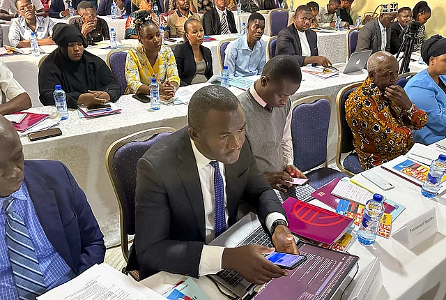 Participants following up on the discussions that took place during the conference