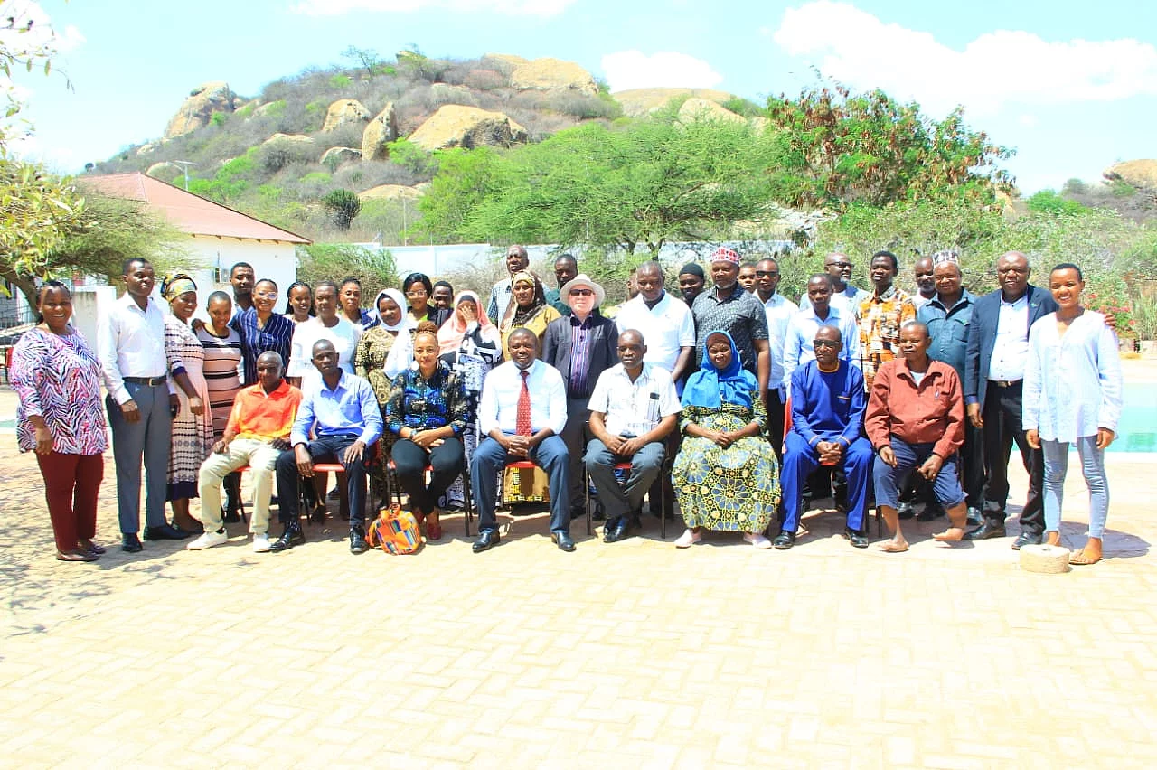 A group photo of stakeholders from various regions of Tanzania who met in Dodoma in November 2024 to discuss the Tanzania Universal Health Coverage Act of 2023 and its implications for informal sector workers in the country.