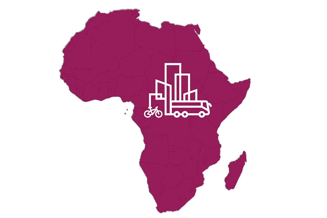 A maroon silhouette of the African continent with a white icon of buildings and a truck superimposed on the central-western region. The icon symbolizes urban infrastructure and industrial activity, suggesting themes of development, logistics, or economic growth across Africa.
